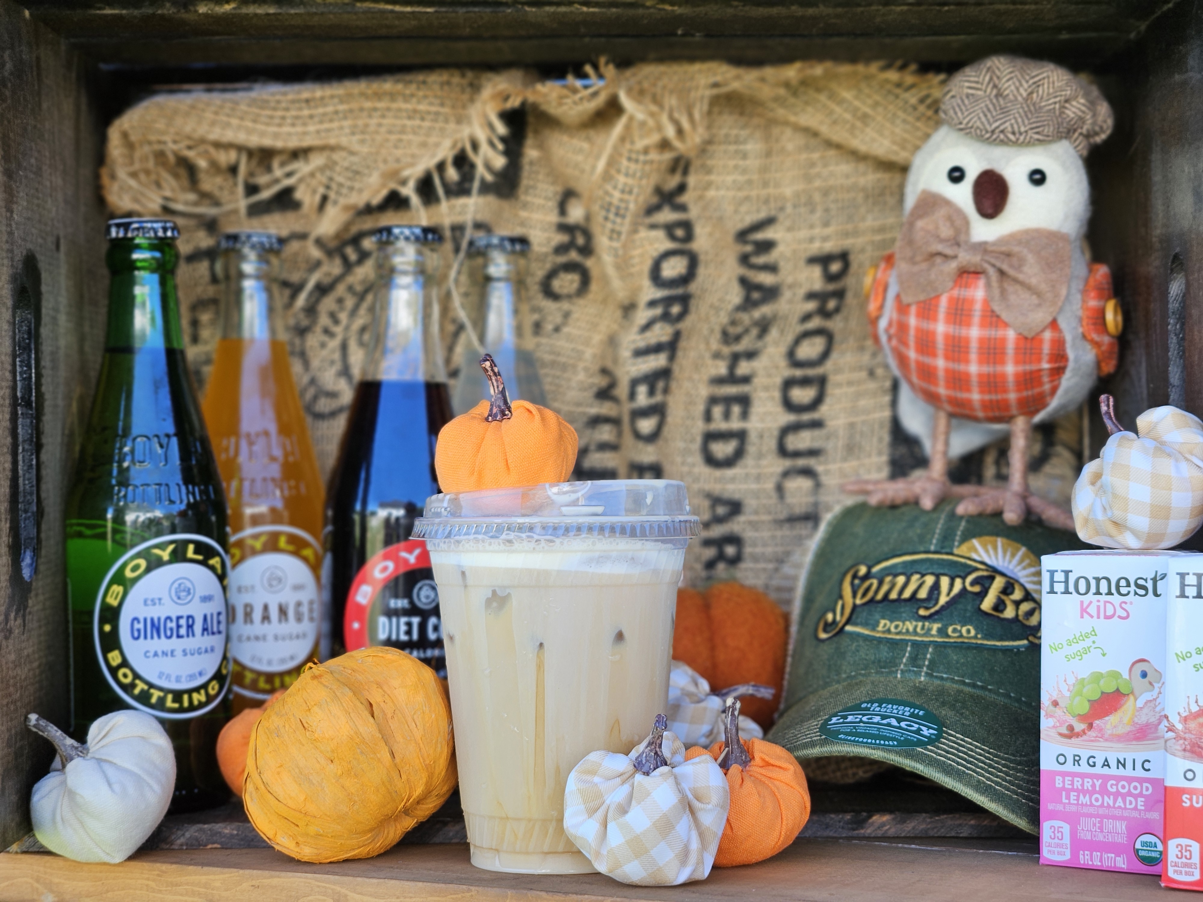 Seasonal display inside the Sonny Boy trailer with iced coffee and harvest decor
