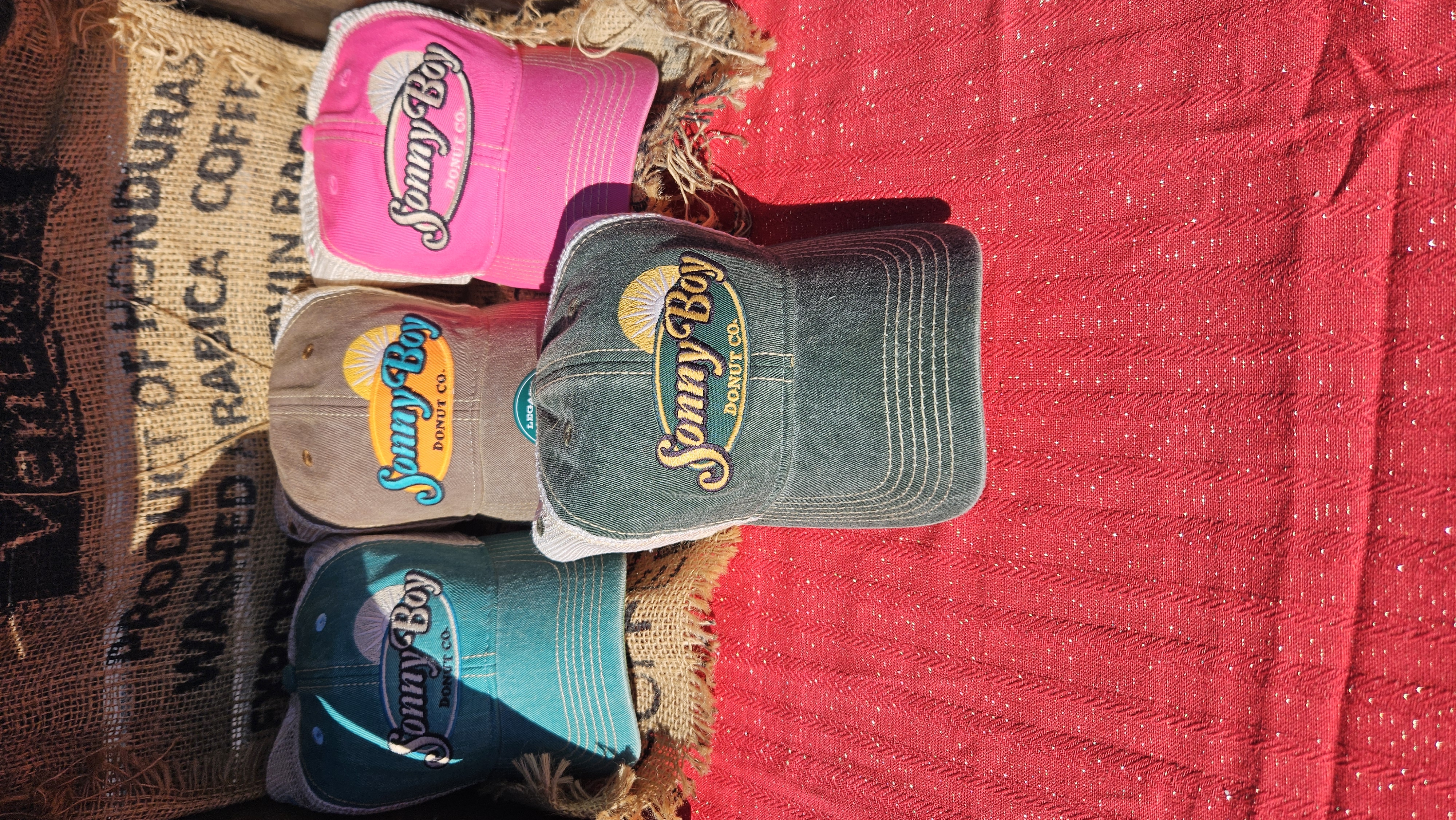 Sonny Boy Donut Co. hats displayed in multiple colors